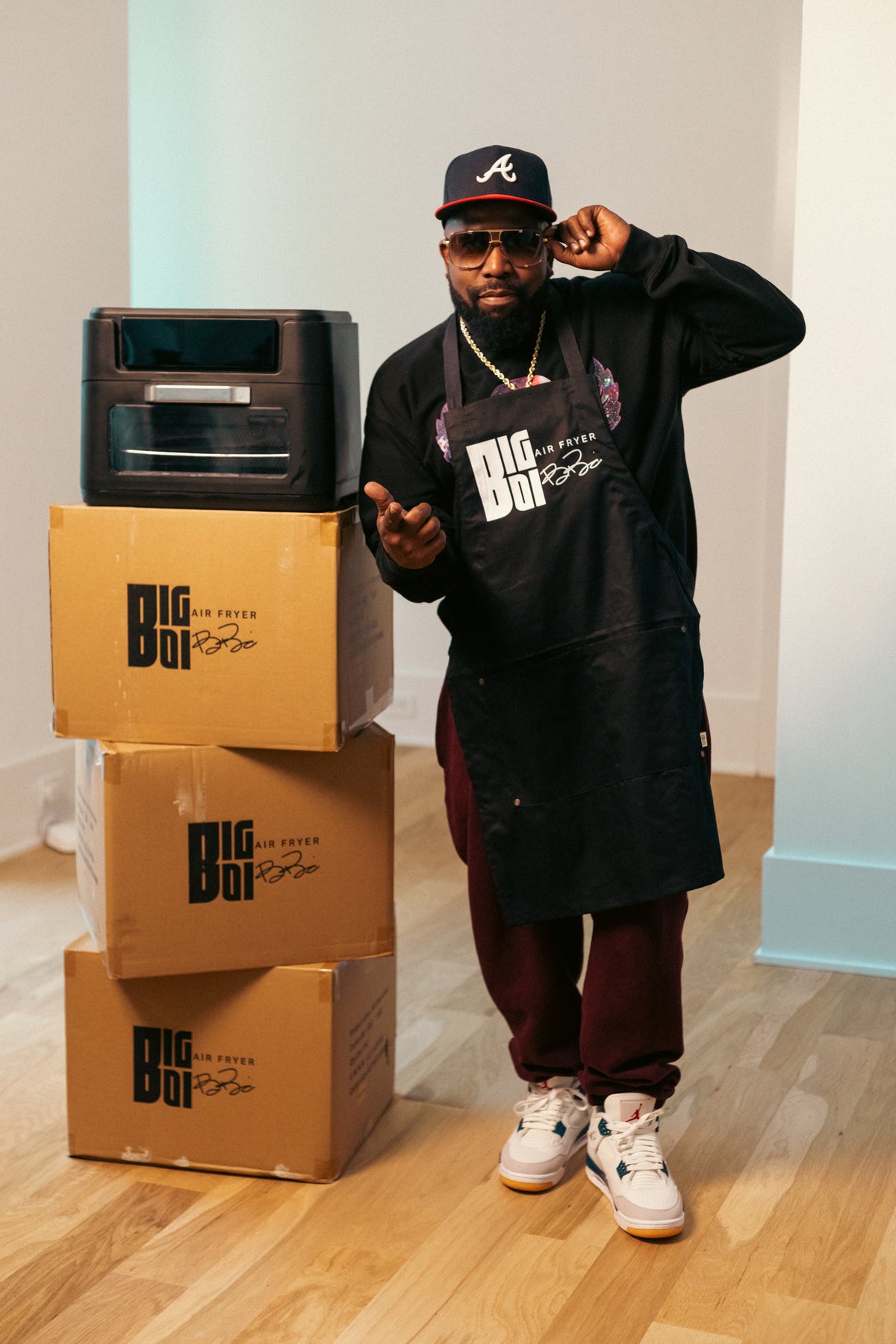 Big Boi wearing the official Big Boi Air Fryer signature apron